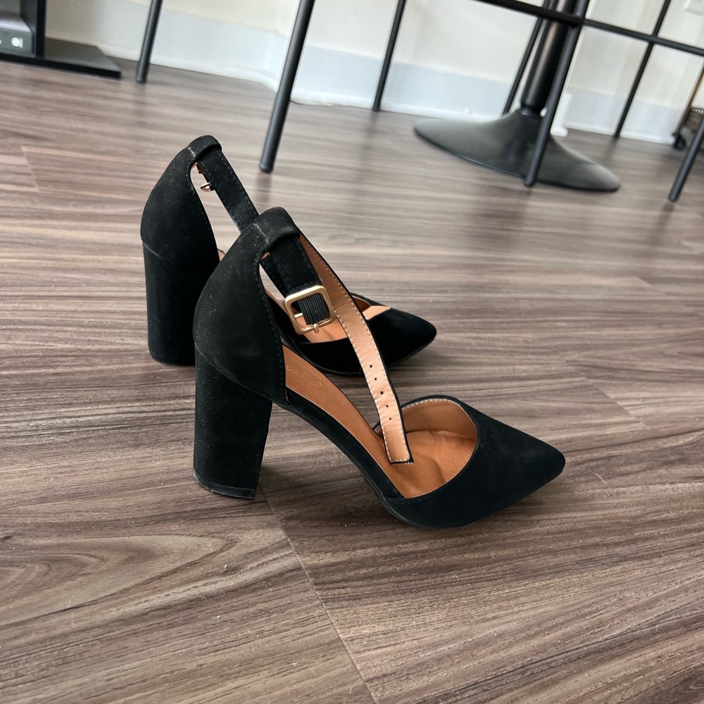 Black suede block heel pointed toe shoe.
